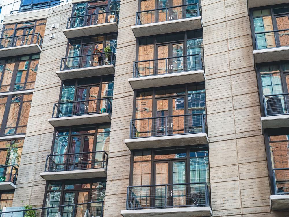 The balconied facade of a modern apartment block