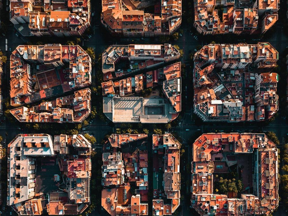 The regular grid of a city’s residential blocks, seen from above
