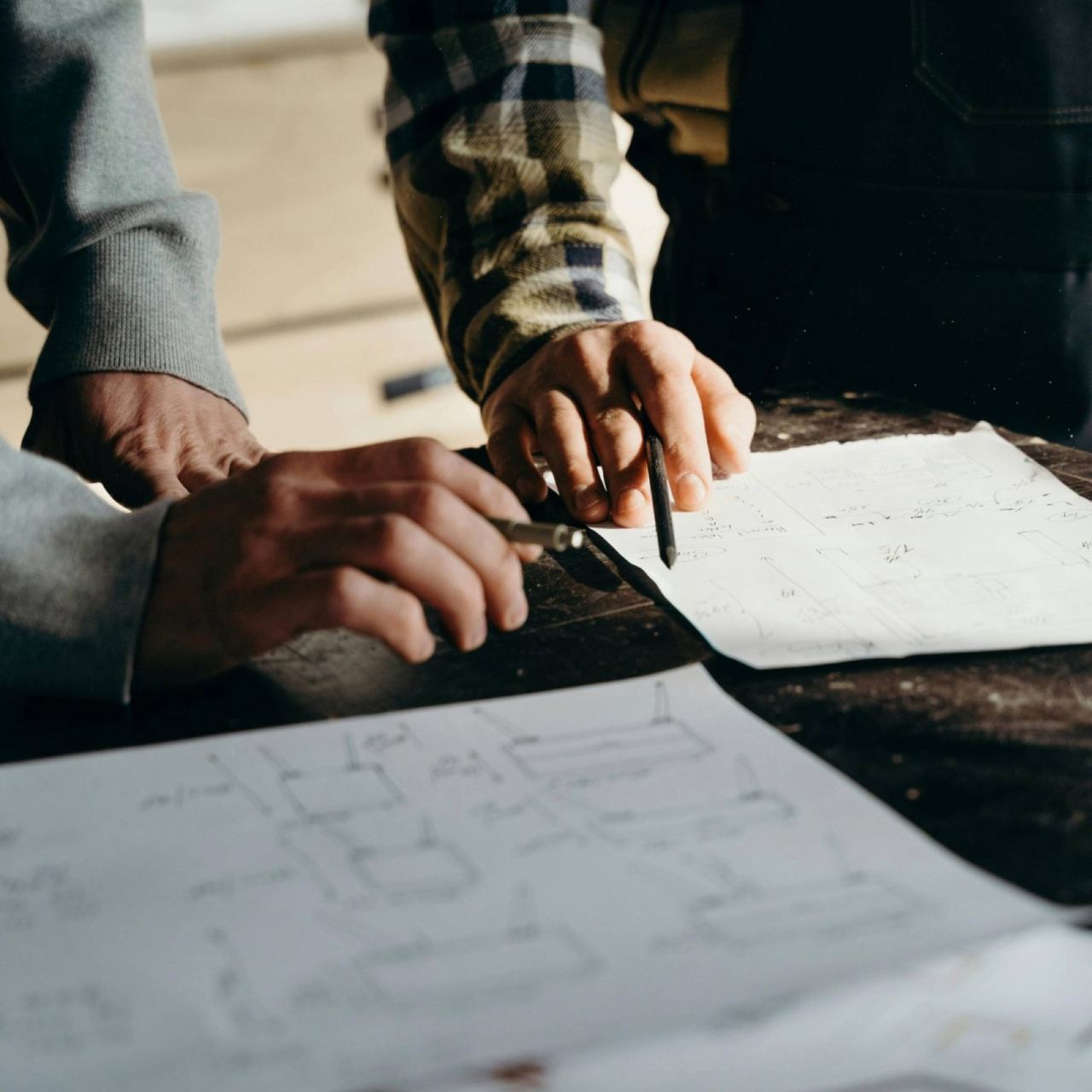 Engineers reviewing plans on site